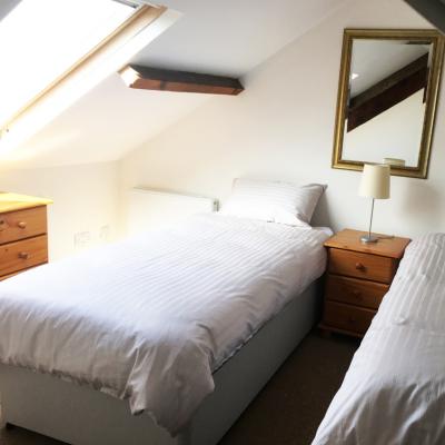 Upstairs bedroom with double beds