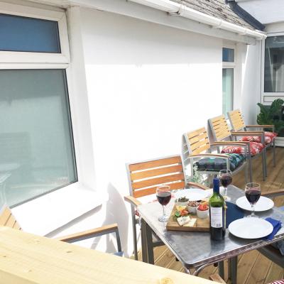 Redwood apartment balcony with table and chairs